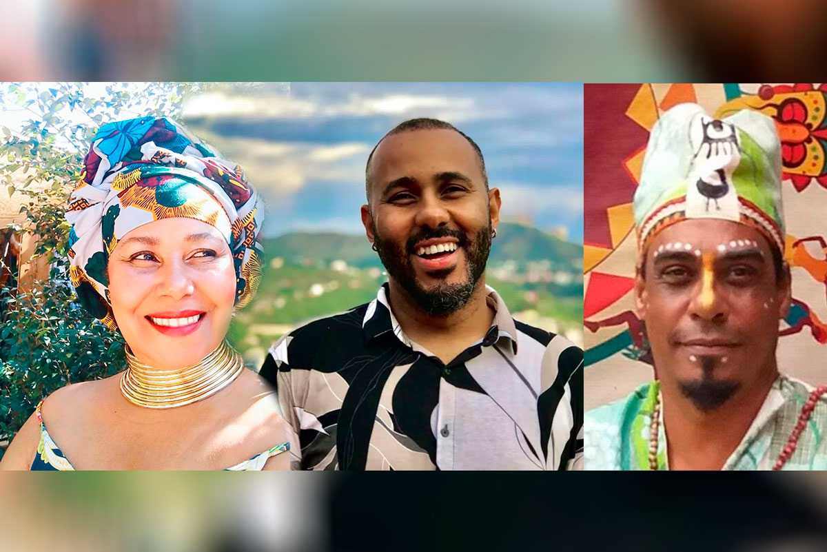  Carlandreia: Mulher negra, usando turbante e sorrindo. Wagner: Homem negro com barba curta e sorrindo. Jacó: Homem negro, com barba apenas no queixo e pinturas no rosto.