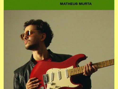 Homem com óculos escuro, jaqueta de couro e guitarra vermelha