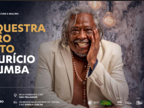 Imagem do cantor maurício Tizumba vestindo um blazer off-white,e com um terço no pescoço