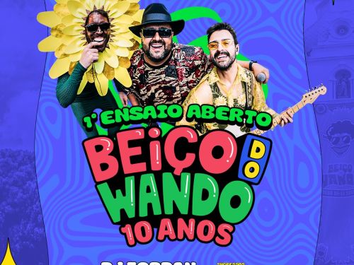 Cartaz colorido com fundo azul psicodélico anunciando o "1º Ensaio Aberto - Beiço do Wando 10 Anos". No centro, três homens sorridentes: um fantasiado de girassol, um de chapéu e óculos escuros, e outro tocando guitarra. Abaixo, as informações: "11 de Janeiro, Domingo, a partir das 10h", "DJ Zordan + Atrações" e o endereço em Belo Horizonte. No canto, o logo da Sympla indica ingressos gratuitos.