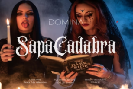 Imagem Ilustrativa de duas mulheres uma segurando um livro a outra a vela mostrando a lingua 